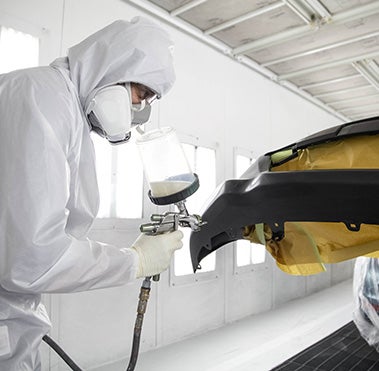 Collision Center Technician Painting a Vehicle | Toyota Direct in Columbus OH